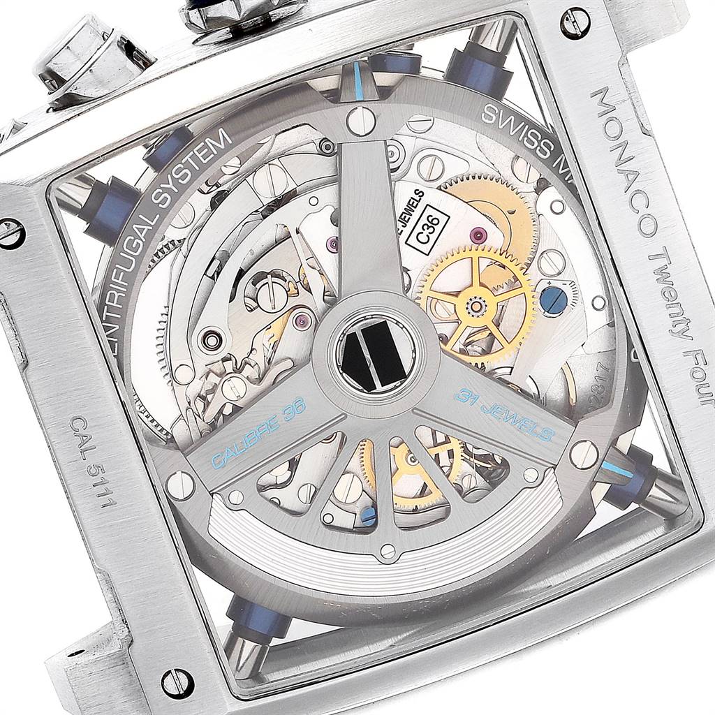 The image shows the back view of a Tag Heuer Monaco CAL5111.FC6299 Men's Stainless Steel Blue Dial CAL5111.FC6299 Men's Stainless Steel Blue Dial watch, highlighting its intricate movement and components.