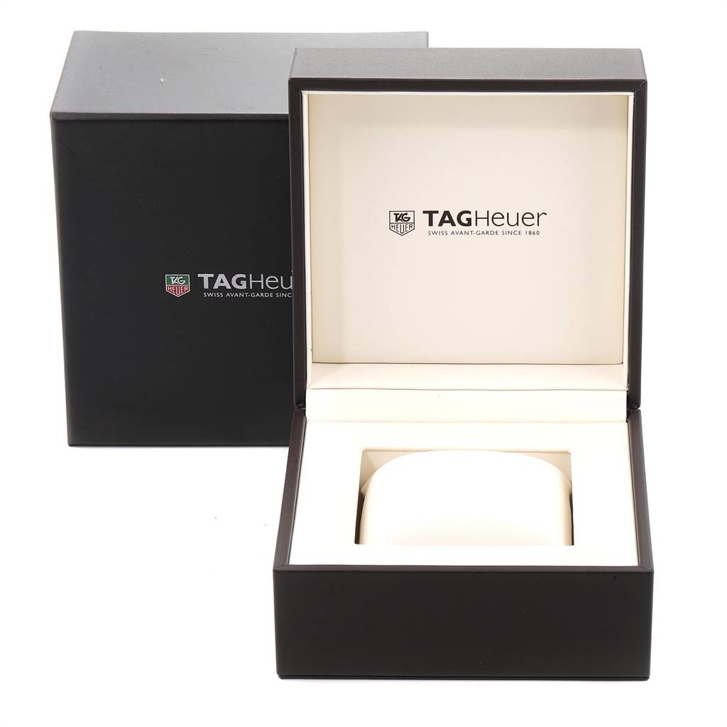 The image shows the packaging box and inner box of a Tag Heuer Monaco CAL5111.FC6299 Men's Stainless Steel Blue Dial CAL5111.FC6299 Men's Stainless Steel Blue Dial model watch, displayed at an angle revealing the Tag Heuer logo.