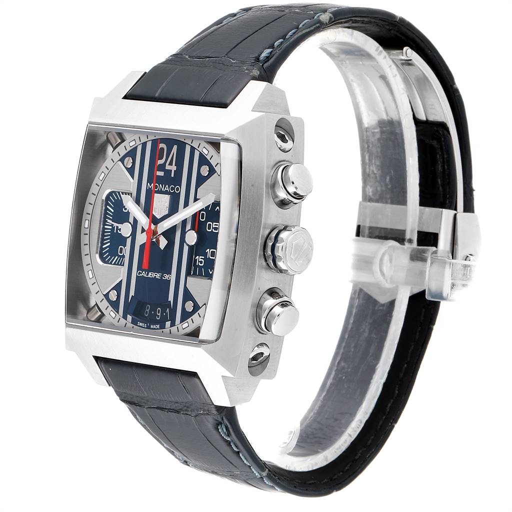 The image shows a side angle of the Monaco model by Tag Heuer, showcasing its metallic buttons and black strap.