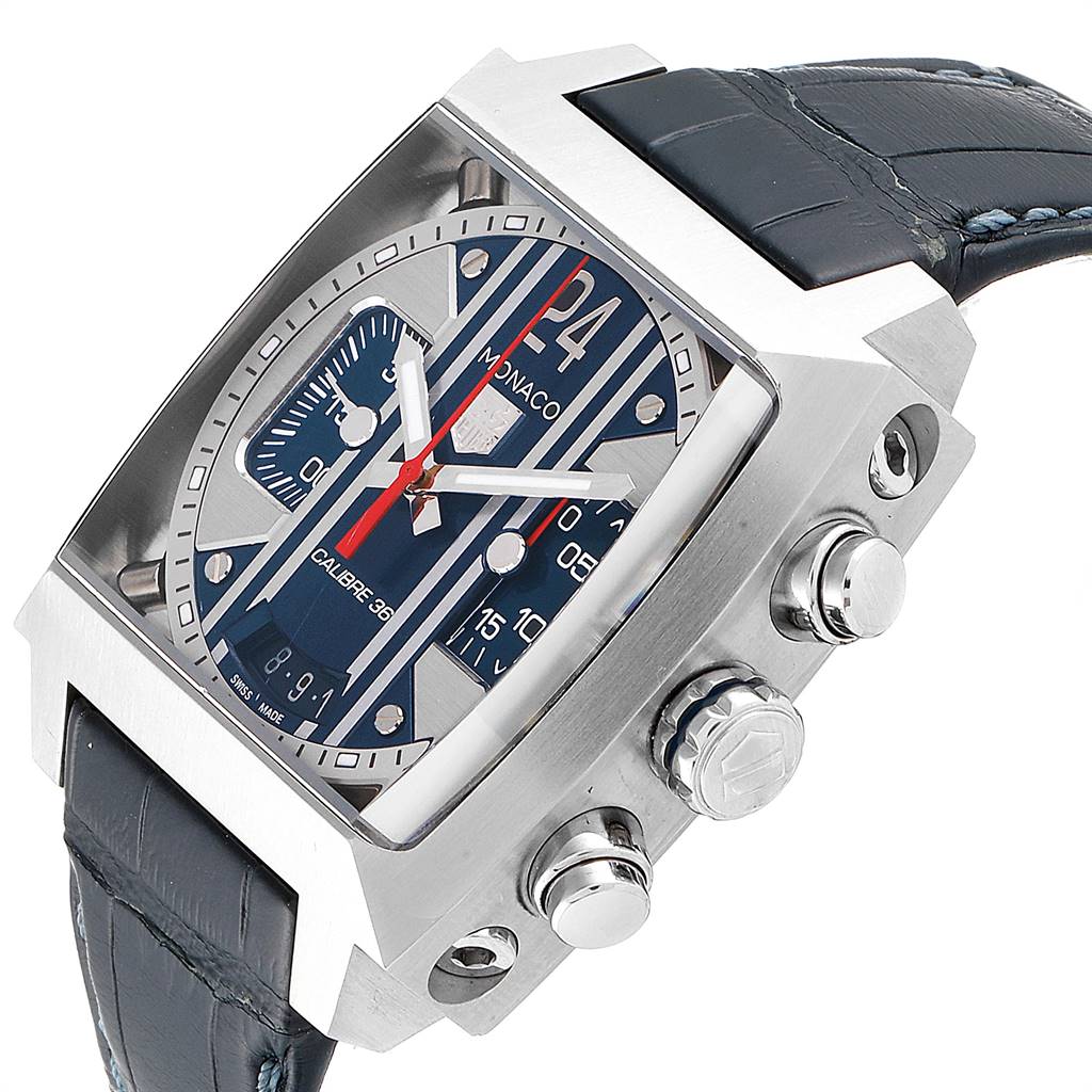 This Tag Heuer Monaco CAL5111.FC6299 Men's Stainless Steel Blue Dial CAL5111.FC6299 Men's Stainless Steel Blue Dial watch is shown from an angle displaying its face, side buttons, and leather strap.