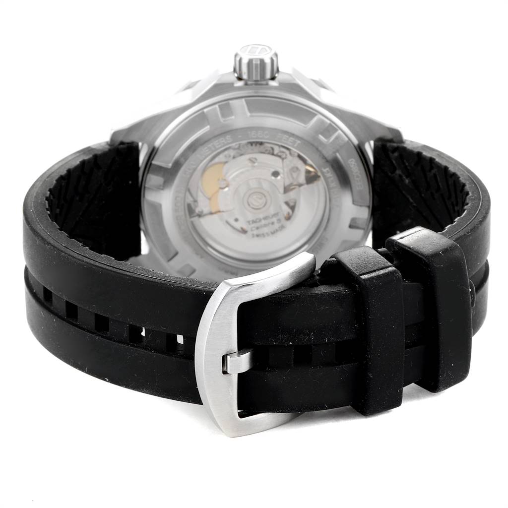 The image shows the back view of a Tag Heuer Aquaracer WAJ2110.FT6015 Men's Stainless Steel Black Dial WAJ2110.FT6015 Men's Stainless Steel Black Dial watch, highlighting the strap buckle and the transparent case back.