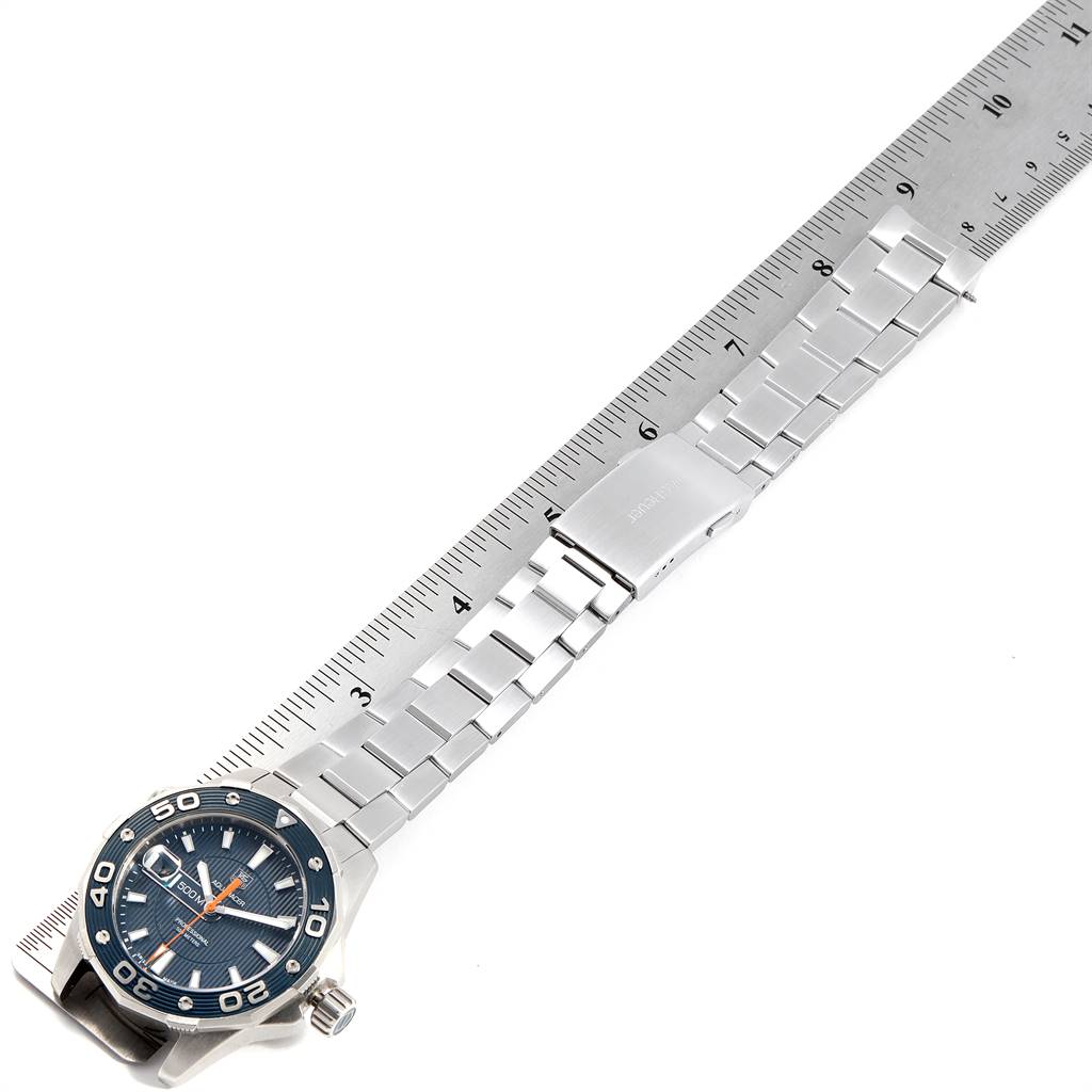 The image shows the Tag Heuer Aquaracer WAJ1112.BA0871 Men
s Stainless Steel Blue Dial WAJ1112.BA0871 Men
s Stainless Steel Blue Dial watch laying flat, with the dial, bezel, bracelet, and clasp visible, alongside a ruler.