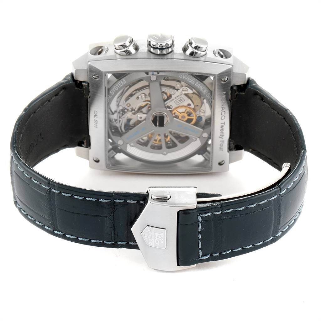 The image displays the back view of the Tag Heuer Monaco CAL5111.FC6299 Men's Stainless Steel Blue Dial CAL5111.FC6299 Men's Stainless Steel Blue Dial watch, highlighting its movement and black leather strap with a clasp.