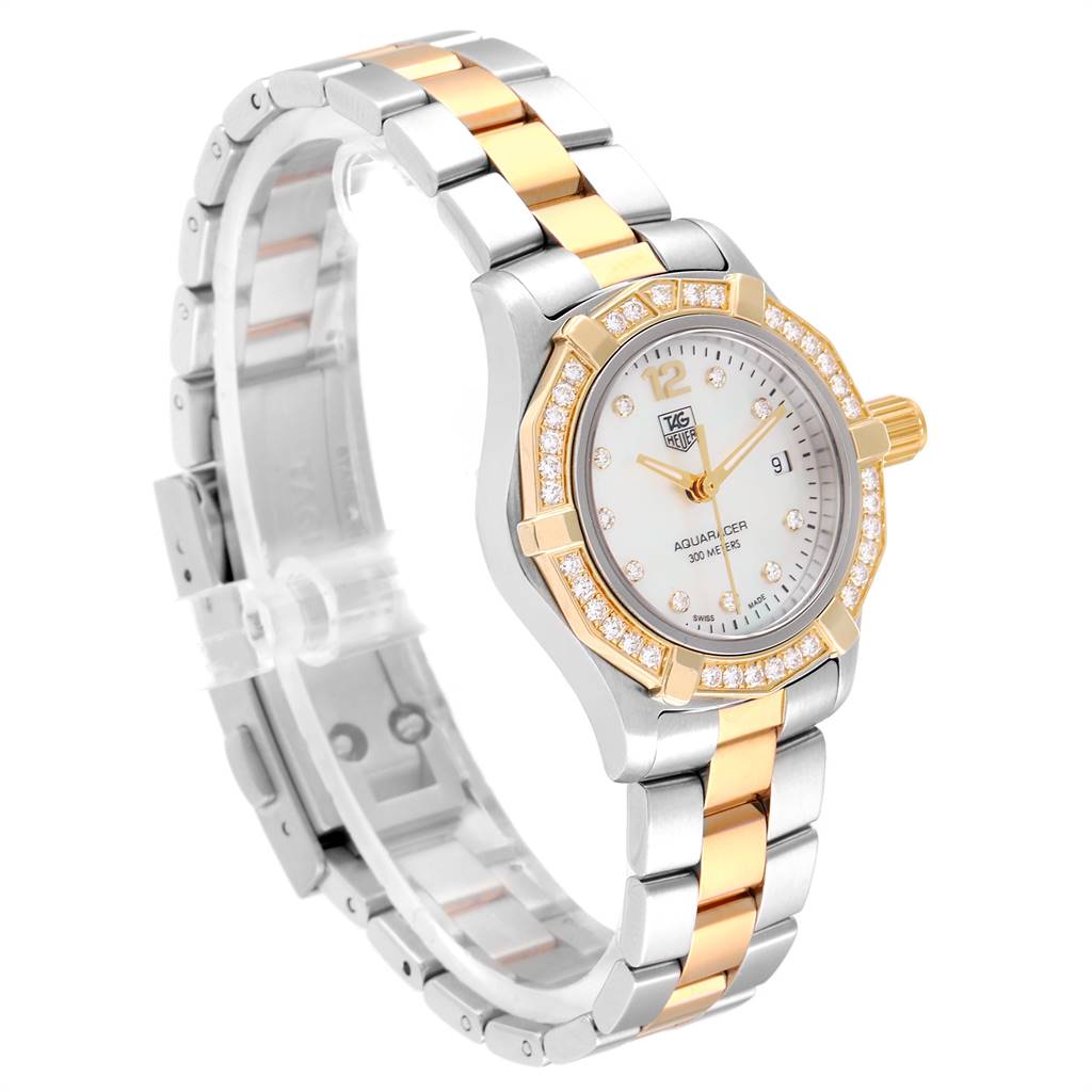This is a side angle view of a Tag Heuer Aquaracer WAF1450.BA0825 Women's Steel and Gold (two tone) Mother of Pearl Dial WAF1450.BA0825 Women's Steel and Gold (two tone) Mother of Pearl Dial watch showing the bezel, dial, crown, and a two-tone metal bracelet.