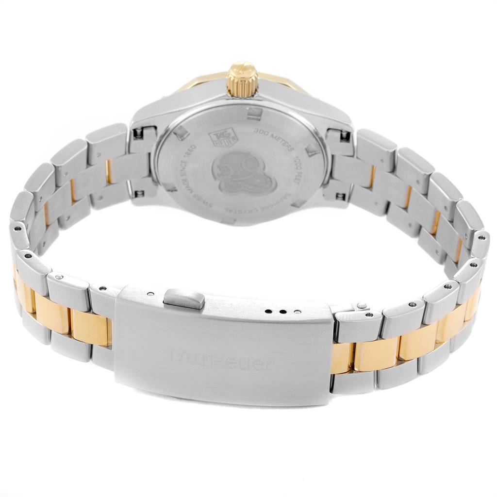 The image shows the back view of a Tag Heuer Aquaracer WAF1450.BA0825 Women's Steel and Gold (two tone) Mother of Pearl Dial WAF1450.BA0825 Women's Steel and Gold (two tone) Mother of Pearl Dial watch, highlighting the case back, bracelet, and clasp.