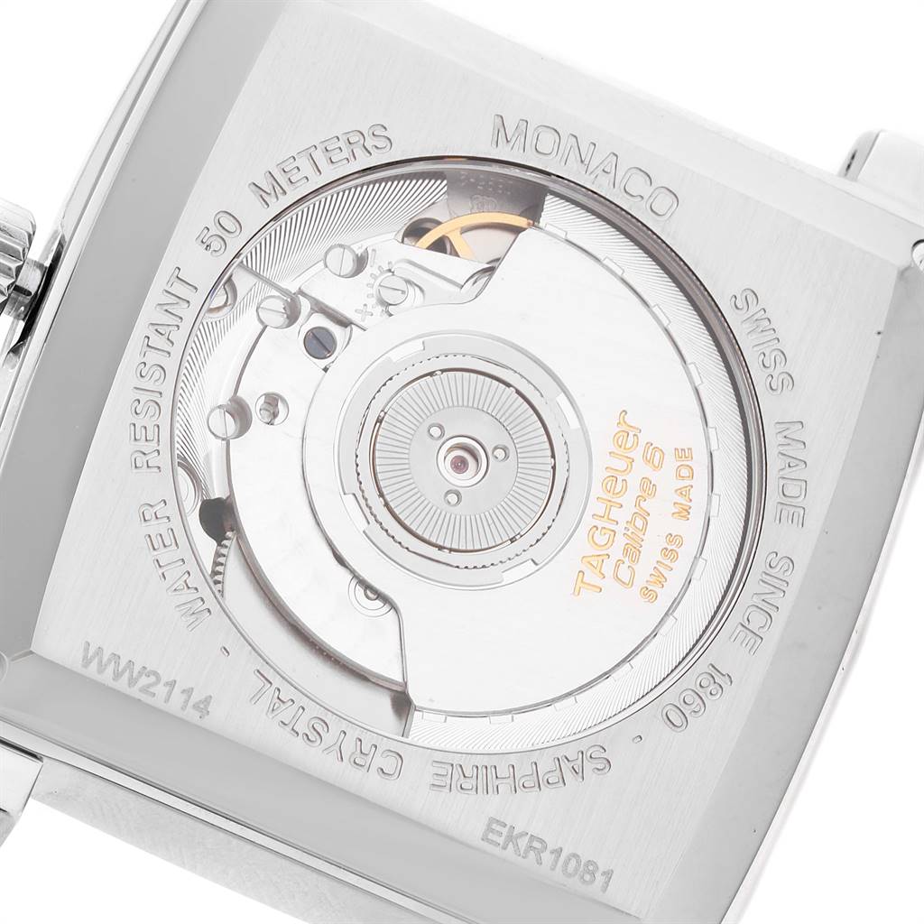 The image shows the back view of a Tag Heuer Monaco WW2114.FC6215 Men's Stainless Steel Mother of Pearl Dial WW2114.FC6215 Men's Stainless Steel Mother of Pearl Dial watch, focusing on its Calibre 5 movement and the engraved details.