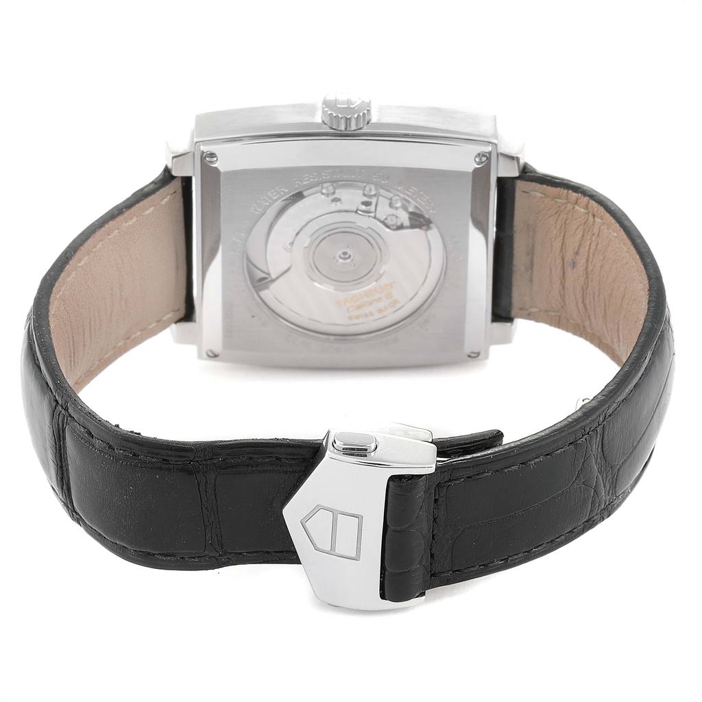 This image shows the back view of a Tag Heuer Monaco WW2114.FC6215 Men's Stainless Steel Mother of Pearl Dial WW2114.FC6215 Men's Stainless Steel Mother of Pearl Dial watch, highlighting its black leather strap and clasp.