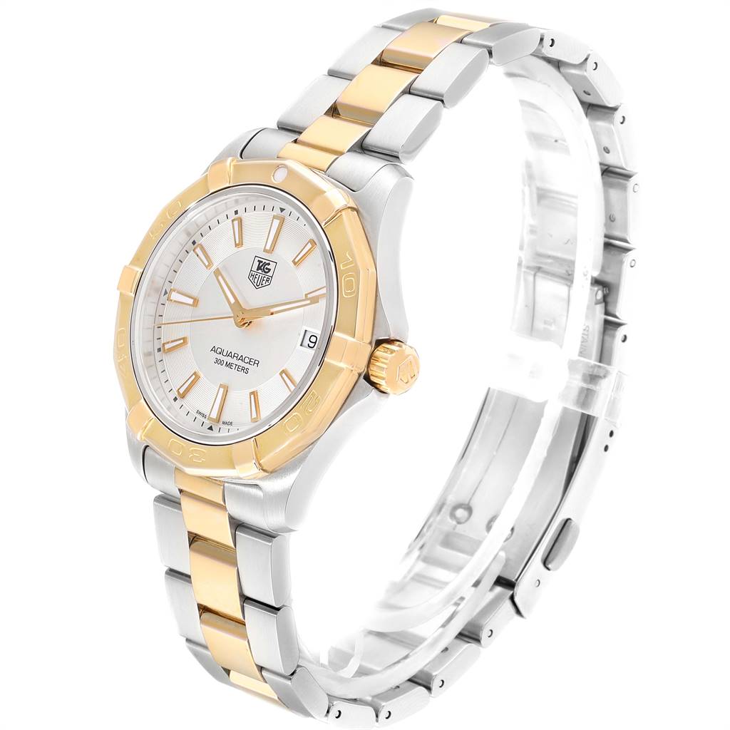 The Tag Heuer Aquaracer WAP1120.BB0832 Men's Steel and Gold (two tone) Silver Dial WAP1120.BB0832 Men's Steel and Gold (two tone) Silver Dial watch is shown from a three-quarter angle highlighting its bezel, dial, hands, bracelet, and crown.