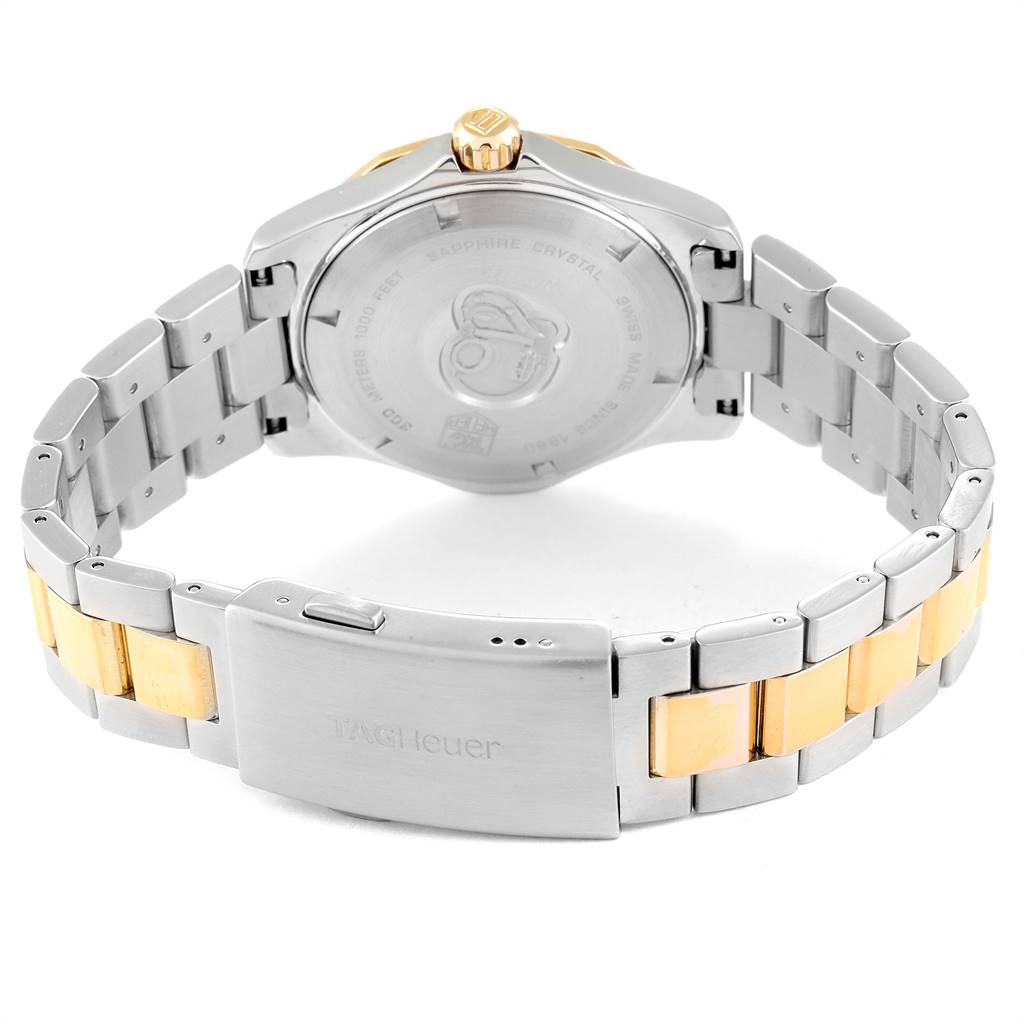 The image shows the back case and bracelet of a Tag Heuer Aquaracer WAP1120.BB0832 Men's Steel and Gold (two tone) Silver Dial WAP1120.BB0832 Men's Steel and Gold (two tone) Silver Dial watch.