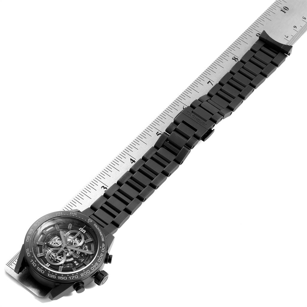 The Tag Heuer Carrera CAR2A91.BH0742 Men's Stainless Steel Black Dial CAR2A91.BH0742 Men's Stainless Steel Black Dial watch is shown at an angle, displaying the full watch band and face, with a ruler for scale.