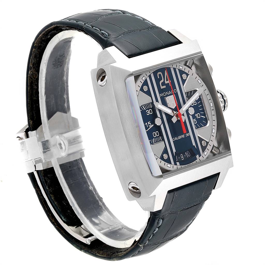 The Tag Heuer Monaco CAL5111.FC6299 Men's Stainless Steel Blue Dial CAL5111.FC6299 Men's Stainless Steel Blue Dial watch is shown at a three-quarter angle, highlighting its square face, side buttons, and leather strap.