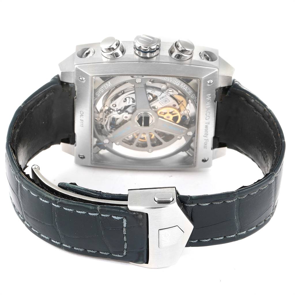 The image shows the back view of a Tag Heuer Monaco CAL5111.FC6299 Men's Stainless Steel Blue Dial CAL5111.FC6299 Men's Stainless Steel Blue Dial watch, highlighting the movement and clasp on the leather strap.