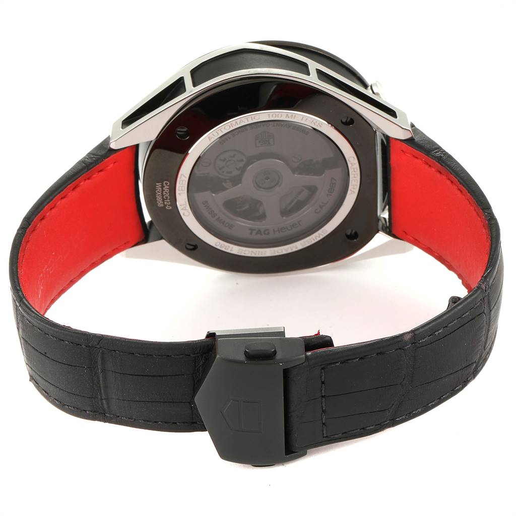 The image shows the back view of a Tag Heuer Carrera CAR2C12.FC6327 Men's Titanium Grey Dial CAR2C12.FC6327 Men's Titanium Grey Dial watch, highlighting its automatic movement and leather strap with a clasp.