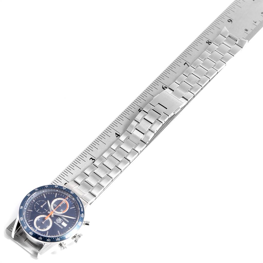 The image shows the Tag Heuer Carrera CV2A1V.BA0738 Men's Stainless Steel Blue Dial CV2A1V.BA0738 Men's Stainless Steel Blue Dial watch face and metal bracelet, measured alongside a ruler for scale.