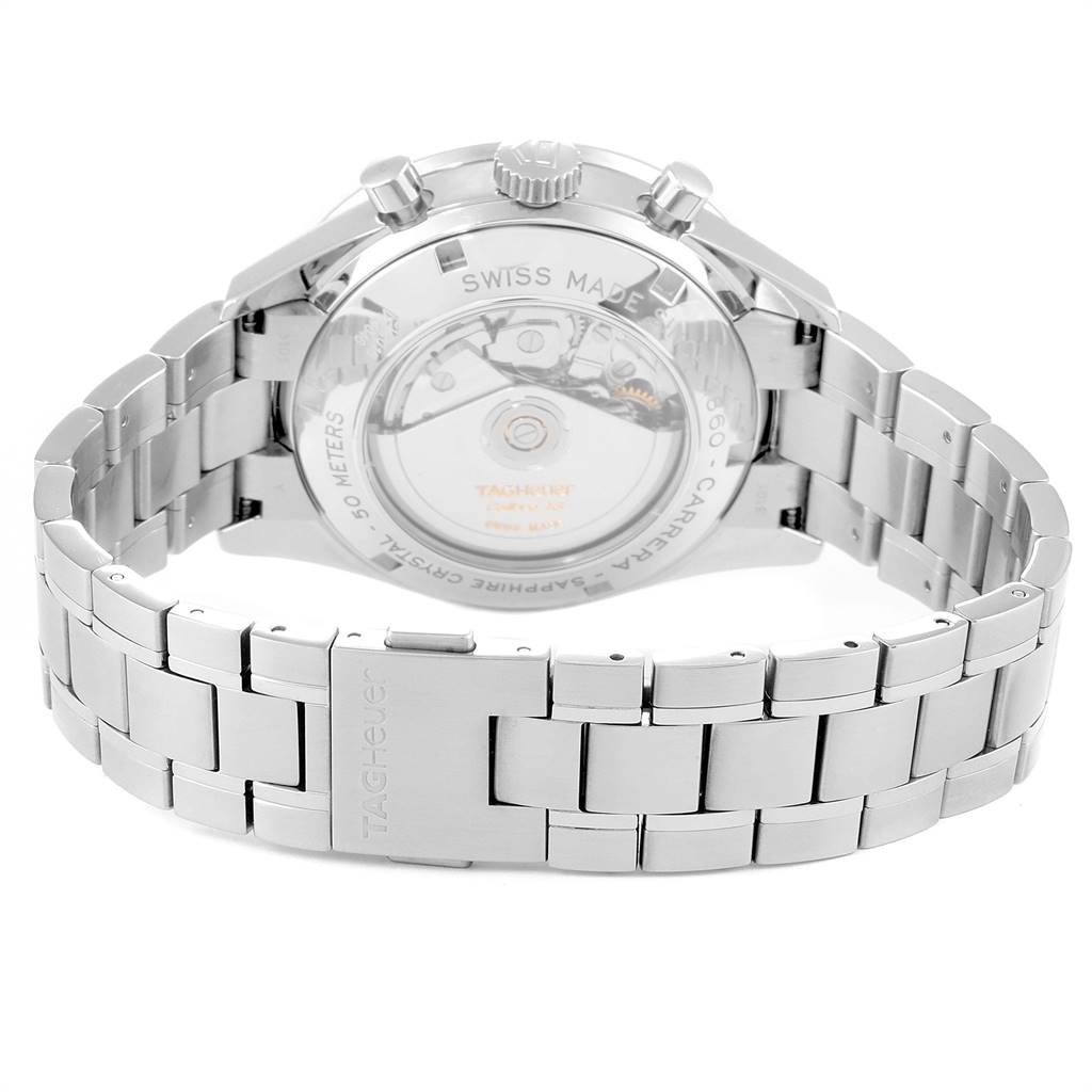 The image shows the back view of the Carrera watch by Tag Heuer, featuring its stainless steel bracelet and transparent case back.