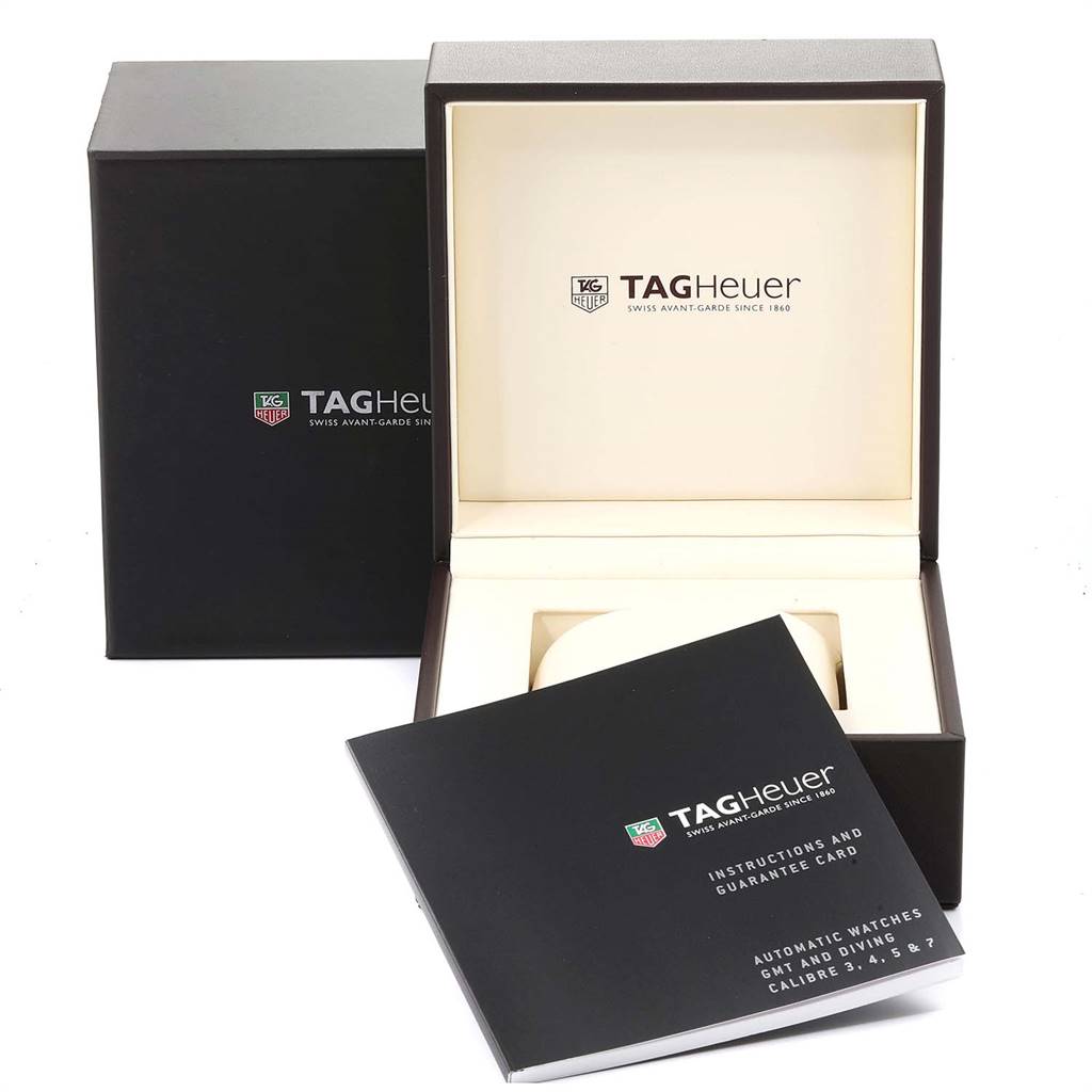 The image shows the tags and a box of a Tag Heuer Aquaracer RWV9540 Men
s Stainless Steel Blue Dial RWV9540 Men
s Stainless Steel Blue Dial watch on a white background.