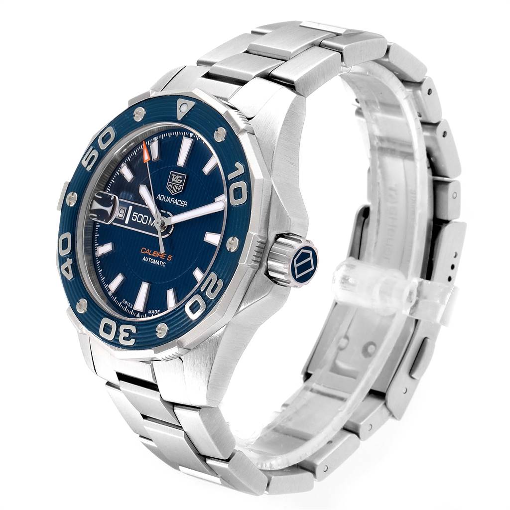 The image shows a Tag Heuer Aquaracer RWV9540 Men
s Stainless Steel Blue Dial RWV9540 Men
s Stainless Steel Blue Dial watch at an angle highlighting its face, bezel, crown, and stainless steel bracelet.
