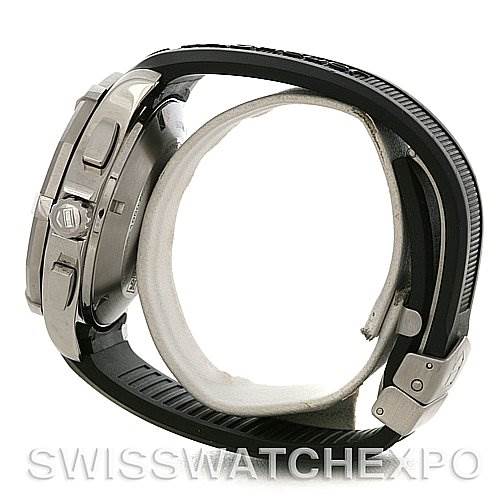 The image shows a side view of a Tag Heuer Aquaracer CAP2111.FT6028 Men's Stainless Steel Silver Dial CAP2111.FT6028 Men's Stainless Steel Silver Dial watch, highlighting the case, crown, pushers, and a portion of the band.