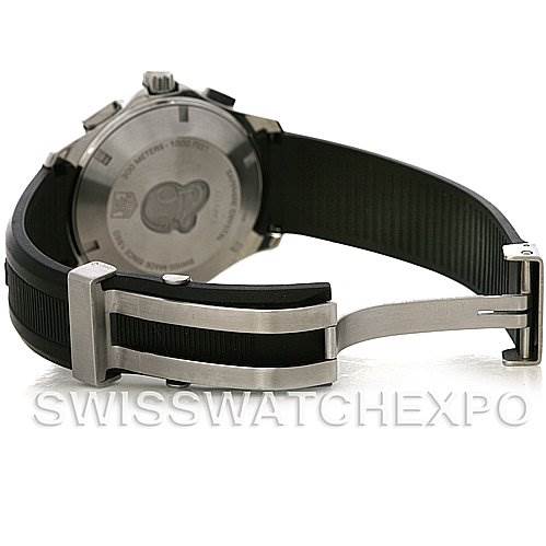 The image shows the back view of a Tag Heuer Aquaracer CAP2111.FT6028 Men's Stainless Steel Silver Dial CAP2111.FT6028 Men's Stainless Steel Silver Dial watch featuring its case back and black rubber strap with a folding clasp.