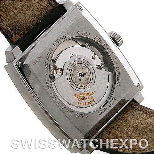 The image shows the back view of a Tag Heuer Monaco WW2110 Men's Stainless Steel Black Dial WW2110 Men's Stainless Steel Black Dial watch, highlighting the movement and rotor details.