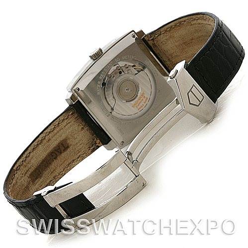 The image shows the backside and inner mechanism of a Tag Heuer Monaco WW2110 Men's Stainless Steel Black Dial WW2110 Men's Stainless Steel Black Dial watch, highlighting its open case back and leather strap with clasp.
