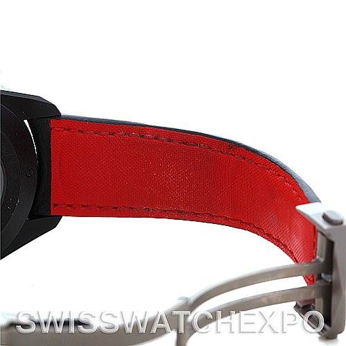 A close-up view of the red underside of the strap and clasp of a Tag Heuer Carrera CAV518B Men's Stainless Steel Black Dial CAV518B Men's Stainless Steel Black Dial watch is shown.