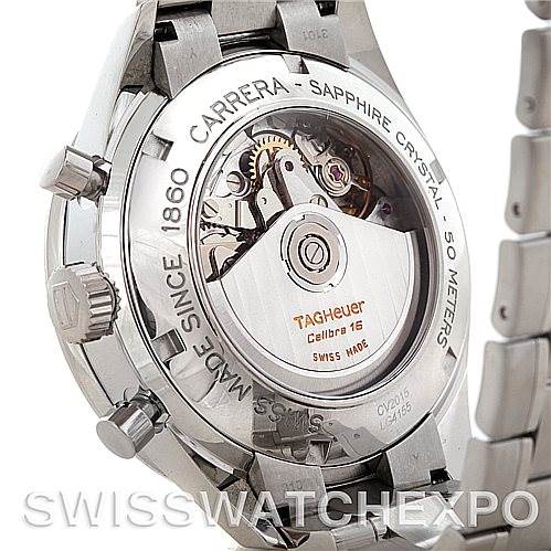 The image shows the back of a Carrera model by Tag Heuer, highlighting its mechanical movement and metal bracelet.
