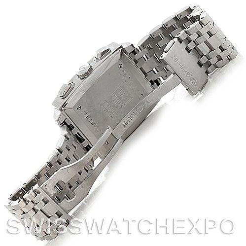 The image shows the Tag Heuer Monaco CW2111.BA078 Men's Stainless Steel Black Dial CW2111.BA078 Men's Stainless Steel Black Dial watch from the back, highlighting the case, bracelet, and clasp from a semi-open angle.