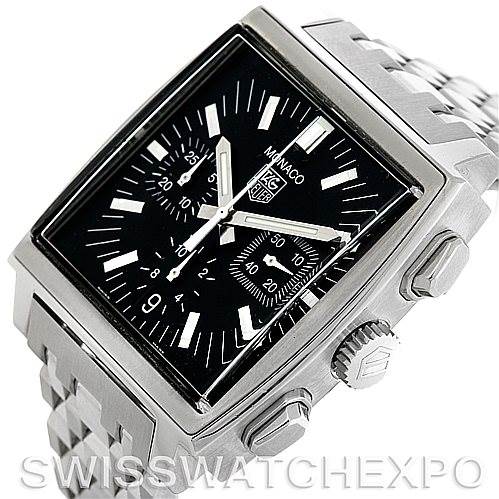 The image shows a Tag Heuer Monaco CW2111.BA078 Men's Stainless Steel Black Dial CW2111.BA078 Men's Stainless Steel Black Dial watch at an angle highlighting the rectangular dial, side buttons, crown, and metal bracelet.