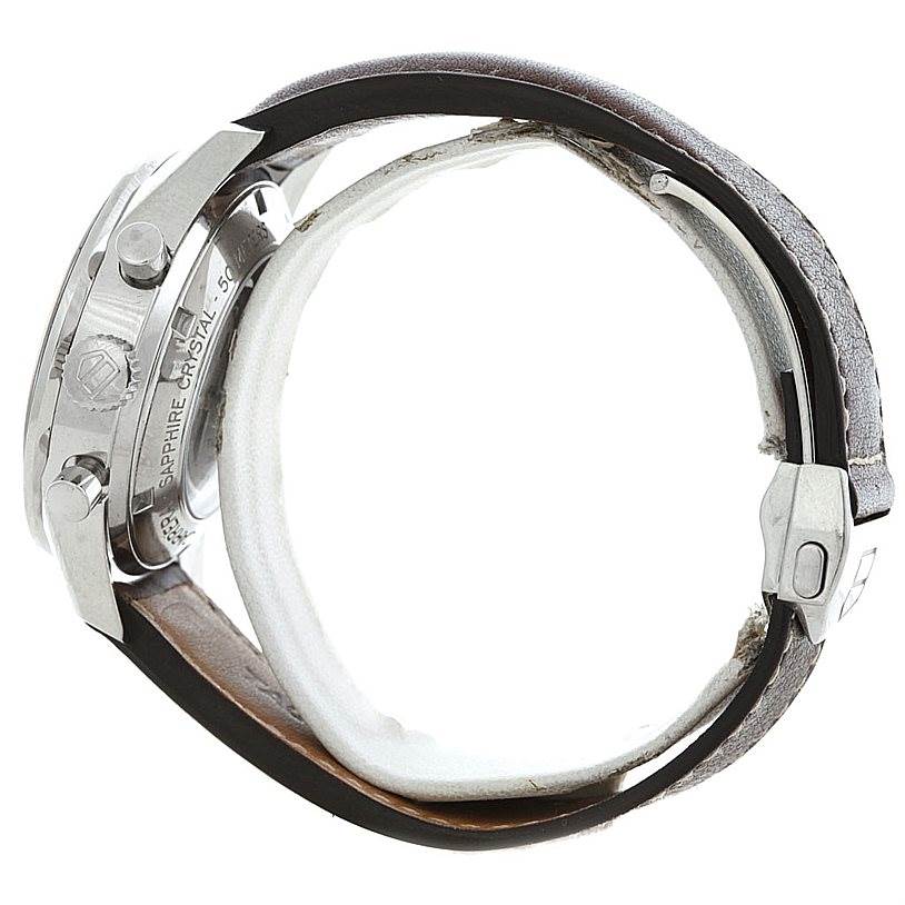 The image shows the side profile of a Tag Heuer Carrera CV2013 Men's Stainless Steel Brown Dial CV2013 Men's Stainless Steel Brown Dial watch, highlighting the case, crown, buttons, and a portion of the leather strap.