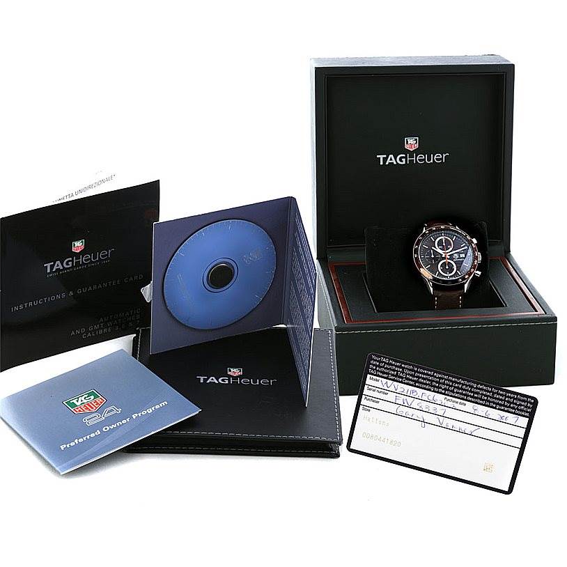 The image shows a Tag Heuer Carrera CV2013 Men's Stainless Steel Brown Dial CV2013 Men's Stainless Steel Brown Dial watch in its box, along with an instruction manual, warranty card, CD, and preferred owner program booklet.
