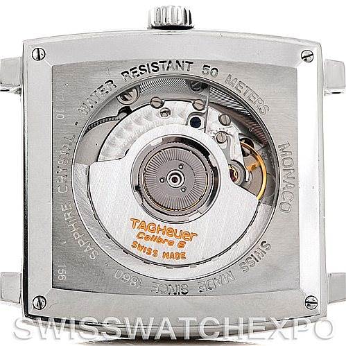 The image shows the back view of a Tag Heuer Monaco WW2110 Men
s Black Dial WW2110 Men
s Black Dial watch, highlighting its automatic movement and various engravings.