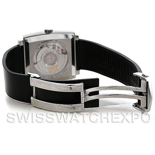 The image shows the back view of a Tag Heuer Monaco WW2110 Men
s Black Dial WW2110 Men
s Black Dial watch, highlighting the movement through the transparent case back and the deployant clasp.