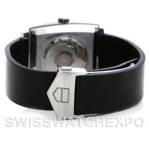 The image shows the back view of a Tag Heuer Monaco WW2110 Men
s Black Dial WW2110 Men
s Black Dial watch, highlighting the rubber strap and clasp.