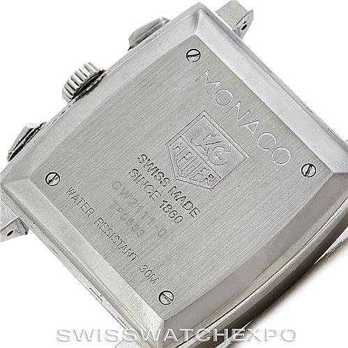 The image shows the back case of a Tag Heuer Monaco CW2111 Men's Stainless Steel Black Dial CW2111 Men's Stainless Steel Black Dial watch, highlighting its branding and specifications.