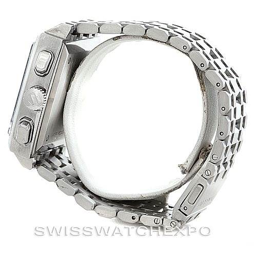 The image shows a side view of the Tag Heuer Monaco CW2111 Men's Stainless Steel Black Dial CW2111 Men's Stainless Steel Black Dial watch, highlighting the stainless steel bracelet and side buttons.