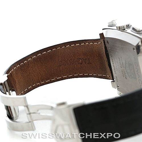 The image shows the clasp, part of the leather strap, and the case back of a Tag Heuer Monaco CW2111 Men's Stainless Steel Black Dial CW2111 Men's Stainless Steel Black Dial watch from a side angle.