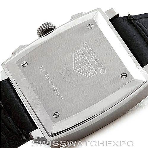 The image shows the back case of the Monaco model by Tag Heuer, featuring the branding and serial number.