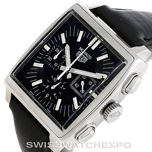 The image shows a Tag Heuer Monaco CS2111 Men's Stainless Steel Black Dial CS2111 Men's Stainless Steel Black Dial watch from an angled top view, highlighting the black dial, rectangular case, chronograph sub-dials, and pushers.