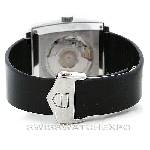 The image shows a Tag Heuer Monaco WW2110 Men
s Stainless Steel Black Dial WW2110 Men
s Stainless Steel Black Dial watch from the rear, highlighting the clasp and exhibition case back.