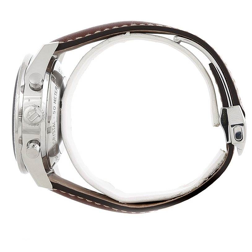 The image shows a side view of a Tag Heuer Carrera CV2013 Men's Stainless Steel Brown Dial CV2013 Men's Stainless Steel Brown Dial watch, highlighting the case, crown, pushers, and leather strap with stitching.