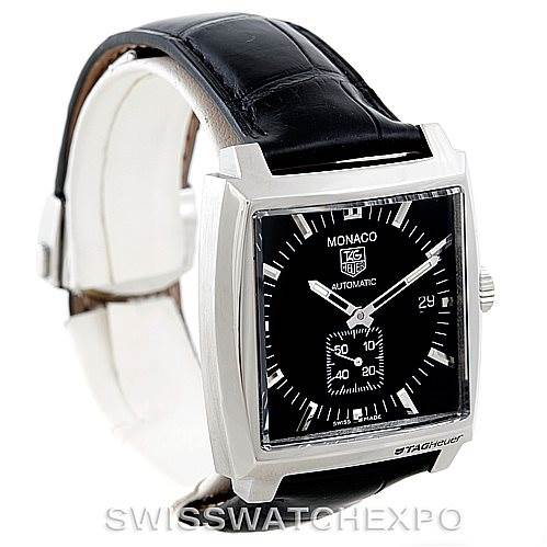 The image shows a Tag Heuer Monaco WW2110 Men's Stainless Steel Black Dial WW2110 Men's Stainless Steel Black Dial watch at a slight angle, displaying its square black dial, black leather strap, and crown.