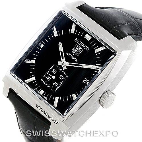 The Tag Heuer Monaco WW2110 Men's Stainless Steel Black Dial WW2110 Men's Stainless Steel Black Dial watch is pictured at an angled view, showing the face, crown, and part of the leather strap.
