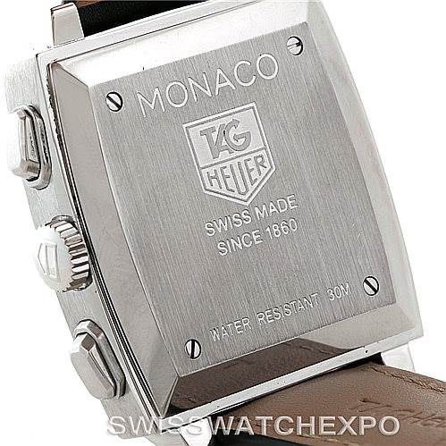 The image shows the backside of a Tag Heuer Monaco CW2111 Men
s Stainless Steel Black Dial CW2111 Men
s Stainless Steel Black Dial watch, highlighting the engraved case back and side pushers.