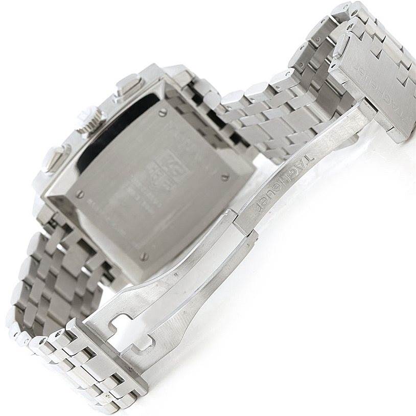 The image shows the back of the Tag Heuer Monaco CW2114 Men's Stainless Steel Brown Dial CW2114 Men's Stainless Steel Brown Dial watch and its partially opened stainless steel bracelet clasp.