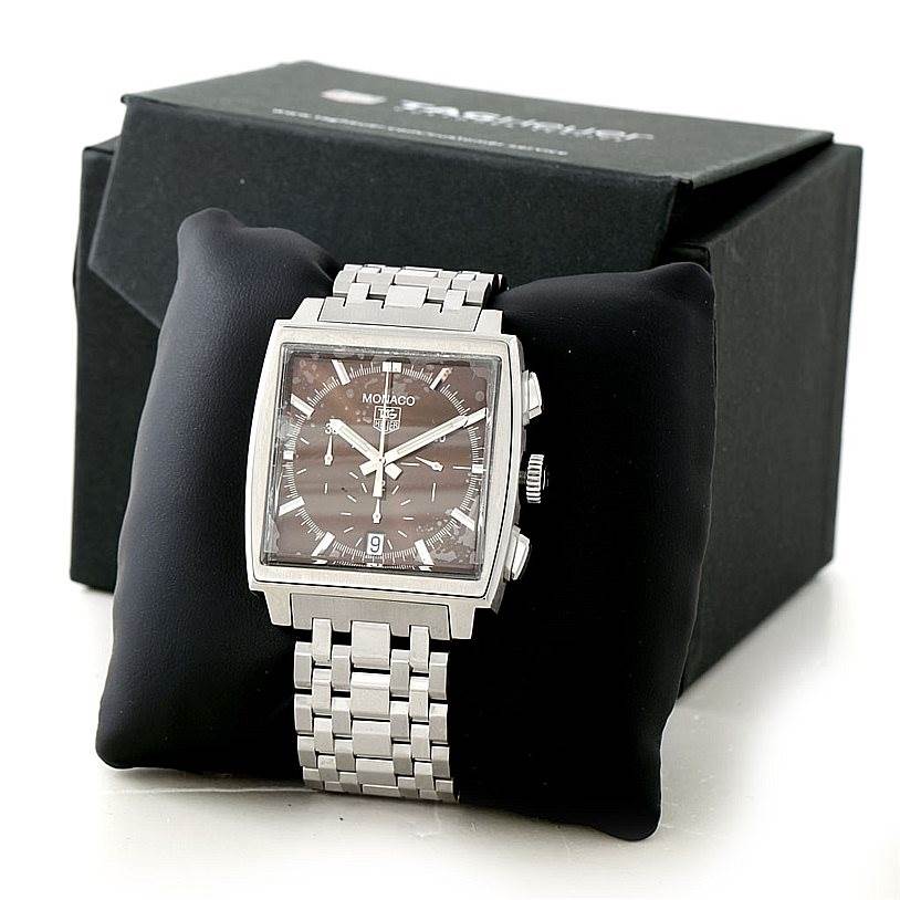The image shows a front view of a Tag Heuer Monaco CW2114 Men's Stainless Steel Brown Dial CW2114 Men's Stainless Steel Brown Dial watch, highlighting its rectangular face and metal bracelet.