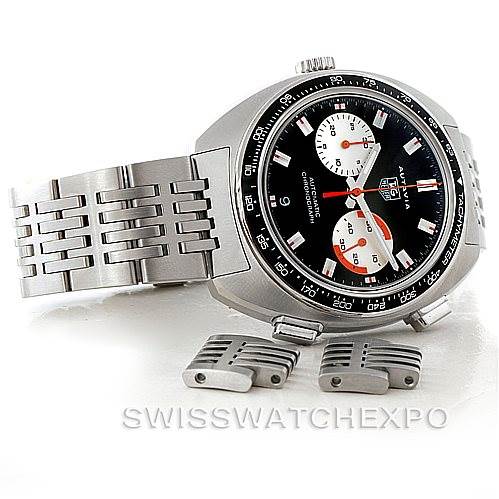 The image shows a Tag Heuer Autavia CY2111 Men
s Stainless Steel Black Dial CY2111 Men
s Stainless Steel Black Dial watch at an angled side view, with extra links and a visible stainless steel bracelet.