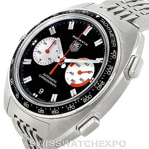 The image shows a close-up of the Tag Heuer Autavia CY2111 Men
s Stainless Steel Black Dial CY2111 Men
s Stainless Steel Black Dial watch dial, bezel, and part of the stainless steel bracelet.