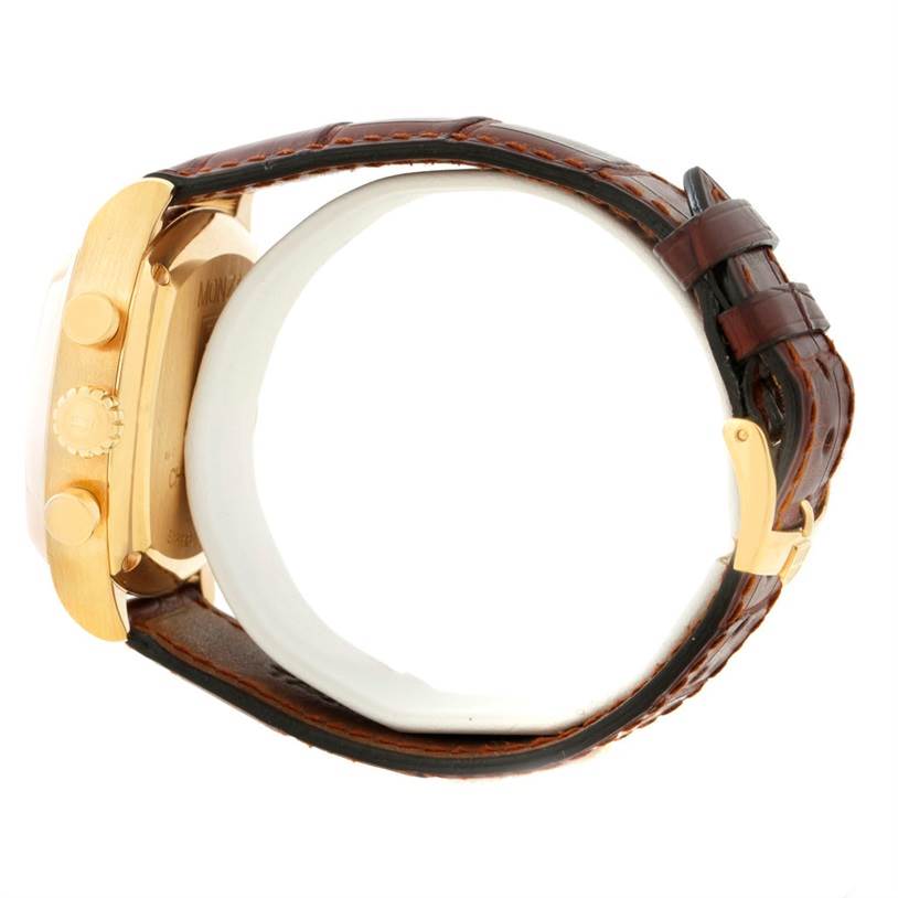 This image of the Tag Heuer Monza CR514A.FC8145 Yellow Gold Silver Dial CR514A.FC8145 Yellow Gold Silver Dial watch is taken from the side, showcasing the crown, pushers, brown leather strap, and buckle.