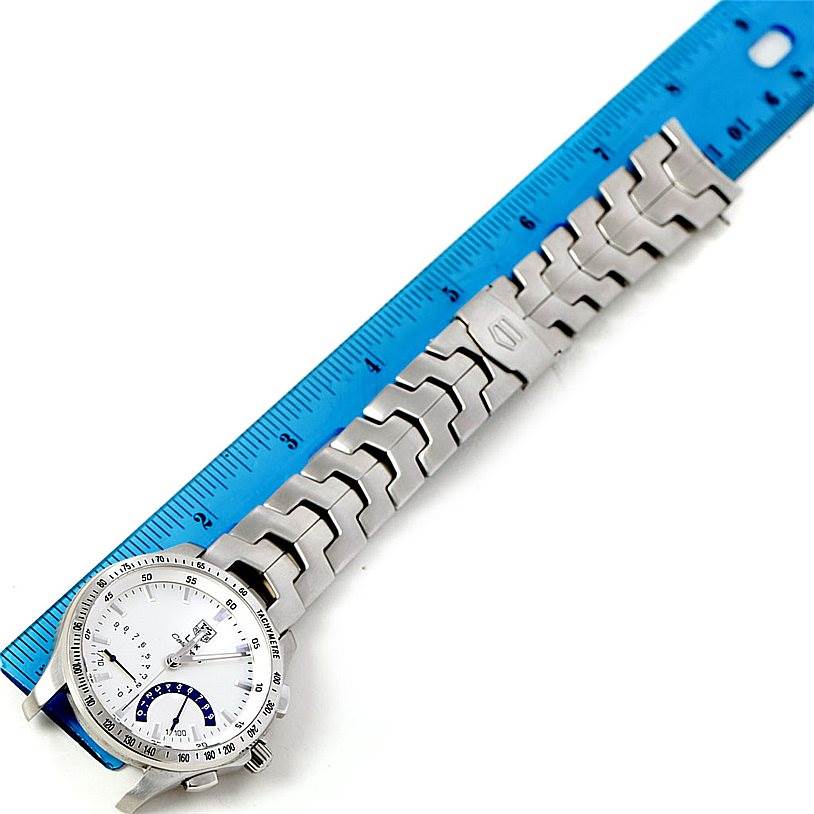 The image shows the face and bracelet of a Tag Heuer Link CJF2150 Men's Stainless Steel Silver Dial CJF2150 Men's Stainless Steel Silver Dial model watch lying next to a ruler for size comparison.